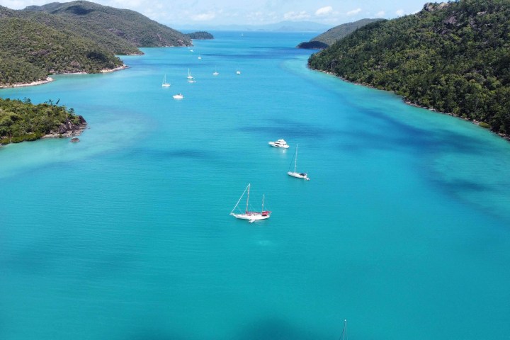 Lady Enid sailing yacht in the calm anchorage of Nara Inlet, Hook Island Whitsundays