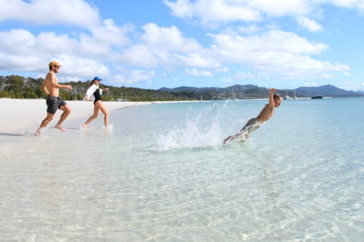 a man riding a wave on top of a body of water