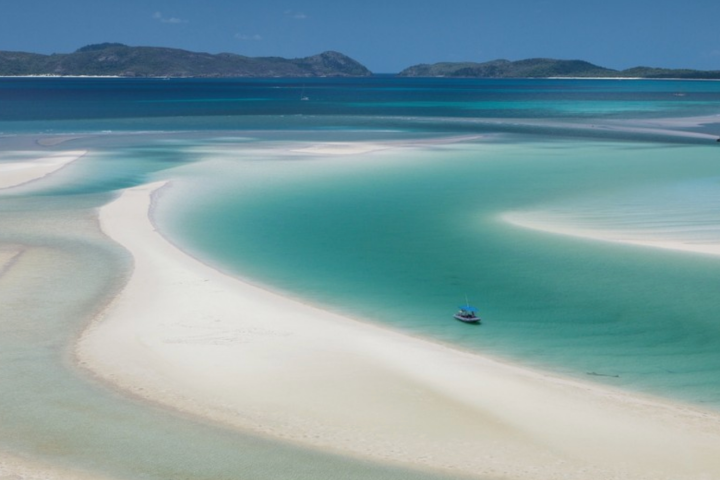a beach next to a body of water