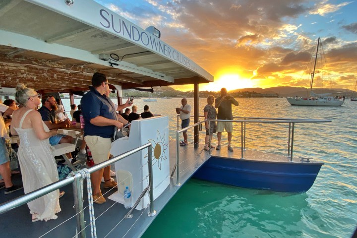 a group of people on a boat in the water