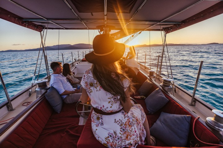 Lady Enid Airlie Beach Whitsundays guests can take a turn steering the yacht from the helm